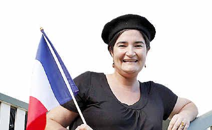 Cecile Espigole, on the steps of her Queenslander home in Maryborough, celebrates Bastille Day. Cecile Espigole, on the steps of her Queenslander home in Maryborough, celebrates Bastille Day.